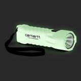 Peli x Carhartt WIP Emergency Flashlight 3310PL Plastic Glow in the dark. Foto de frente a 3/4 no escuro.